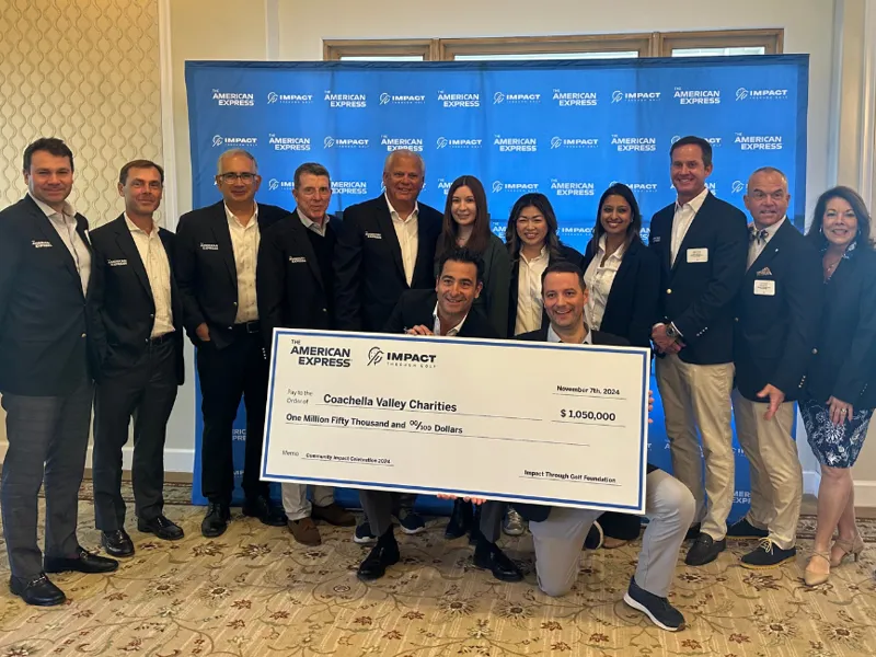 group of people holding check for charities