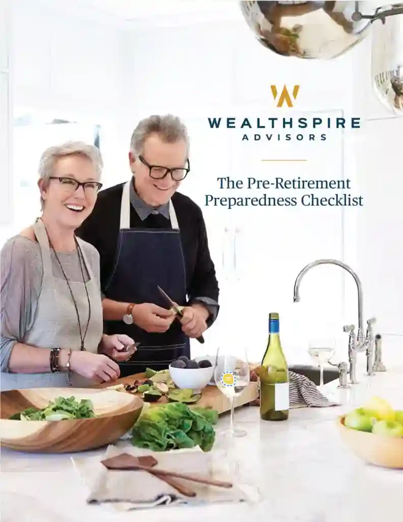 Elderly couple cooking together in a modern kitchen.